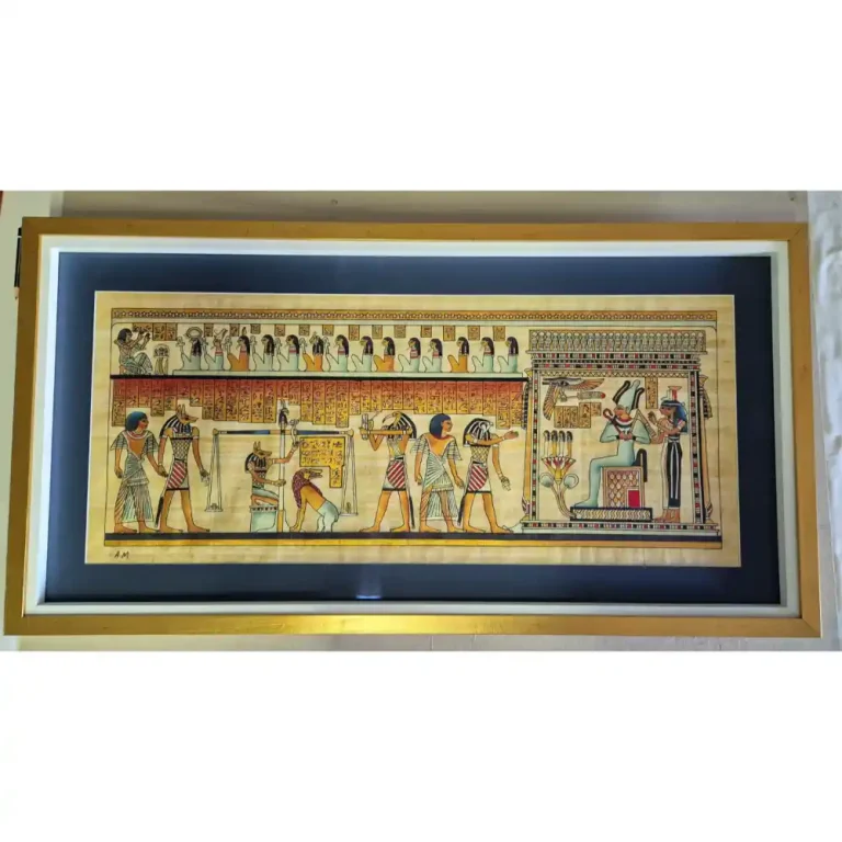 Egyptian style artwork that has a gold frame.