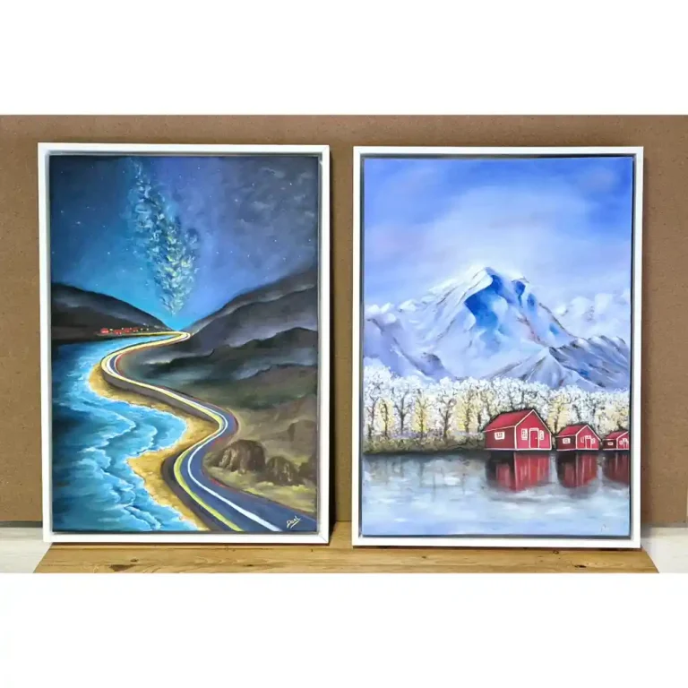 Two paintings of snowy scenery and some northern lights that are framed with a white border.