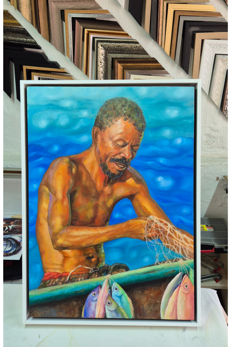A painting of a fisherman at a boat with fish framed in a white border.