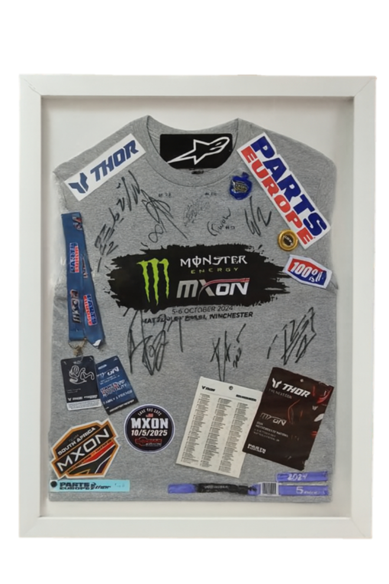 Framed jersey that contains signatures and tags of the event.